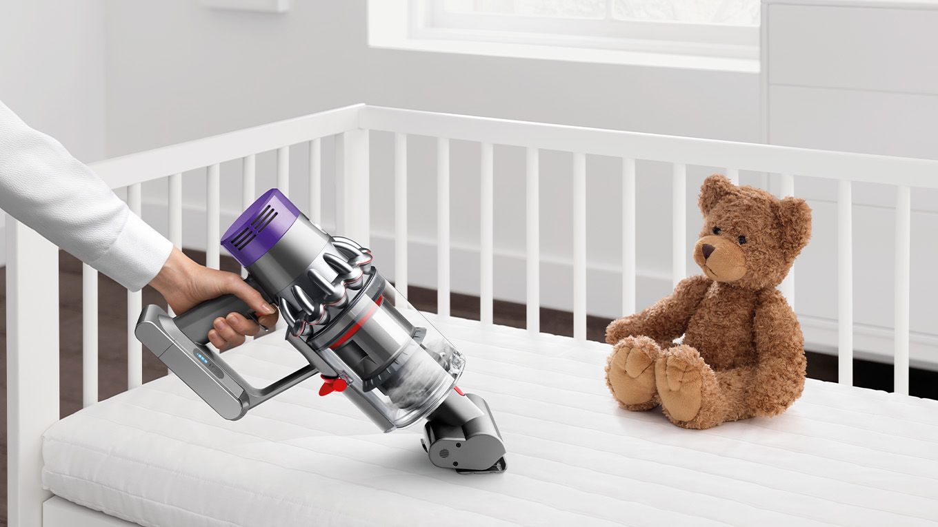 Dyson cordless vacuum used to clean child's bed